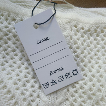 Cardboard tags with care icons and space for indicating the composition INS_59_00002