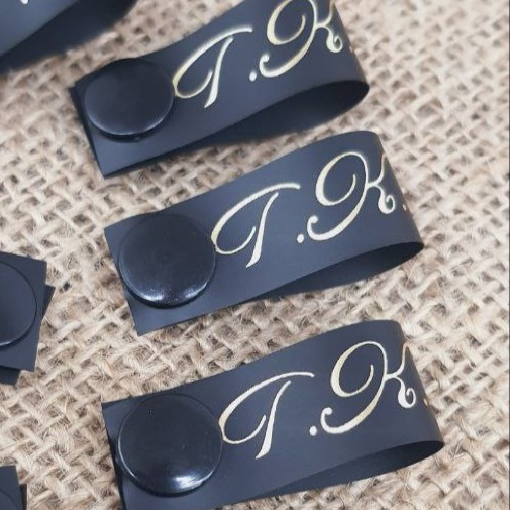 Black silicone tags with a button 1.5 cm