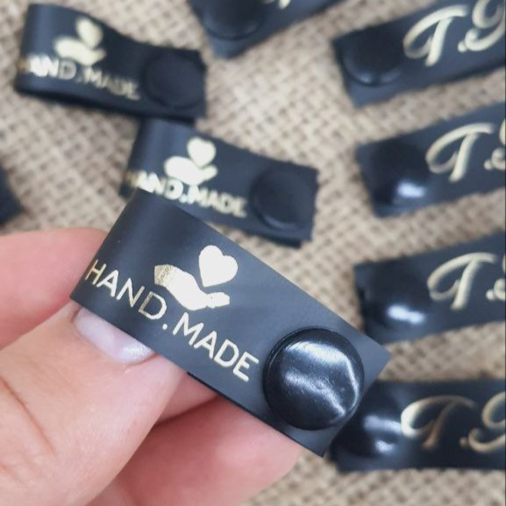Black silicone tags with a button 1.5 cm