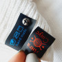Black silicone tags for printing composition/care (on screw and sewn) 2cm