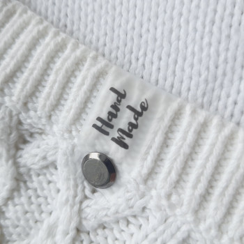 Silicone tags with screws with an inscription «Hand Made» on each side. SL_005